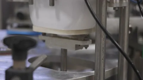 Conveyor filling white plastic boxes with chocolate ice cream Stock Footage 165270017