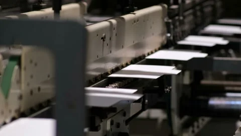 Conveyor line for the production of boxes. Machine carves cardboard boxes Stock Footage 144582135