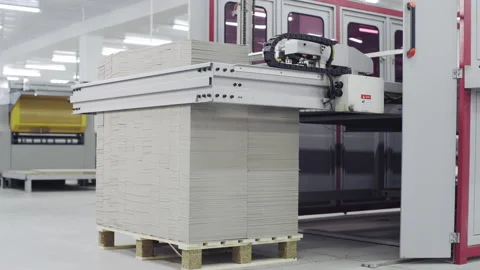 Conveyor line for the production of boxes. Machine carves and bends cardboard Stock Footage 150579105