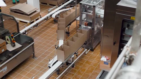 Conveyor line for the production of boxes. Ready-made cardboard boxes from Stock Footage 142387400