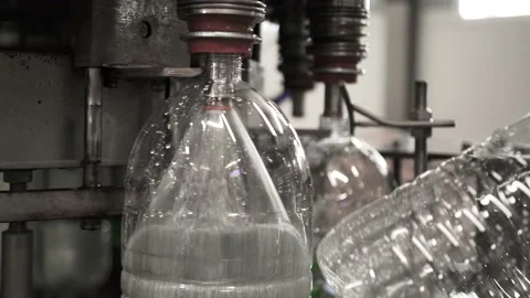 Conveyor line for the production of drinking spring water into plastic bottles Stock Footage 161827916