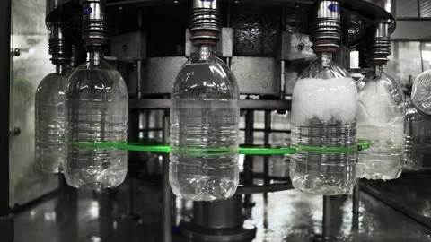 Conveyor line for the production of drinking spring water into plastic bottles Stock Footage 161828774