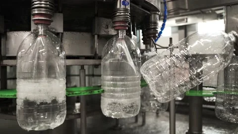 Conveyor line for the production of drinking spring water into plastic bottles Stock Footage 161828900