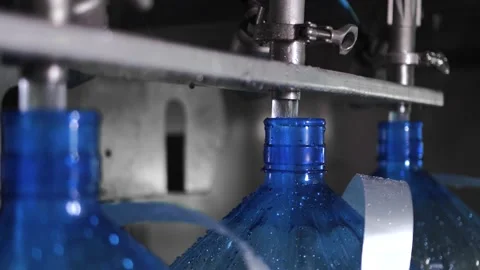 Conveyor line for the production of drinking spring water into plastic bottles Stock Footage 161988403
