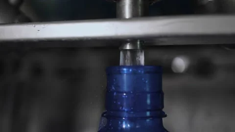 Conveyor line for the production of drinking spring water into plastic bottles Stock Footage 163413142