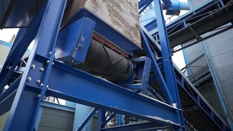Conveyor line is turned on, rubber coating is brushed off plastic particles Stock Footage 119049515