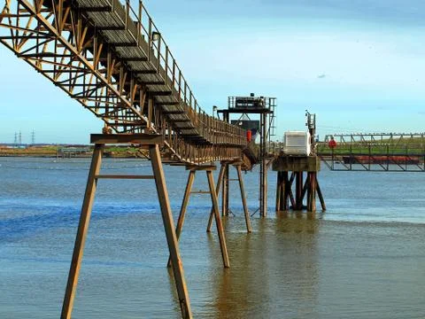 Conveyor for loading/unloading ships on river Stock Photos