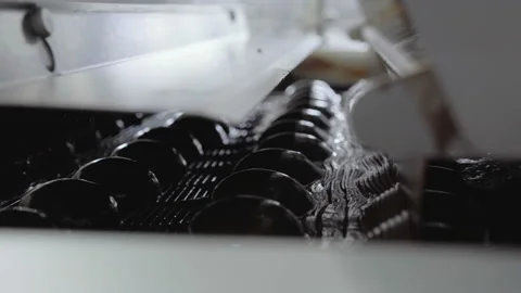 Conveyor with a lot of marshmallows entering the installation for chocolate Vídeos de archivo 114075587