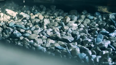 Conveyor machine is relocating copper ore in slow motion Stock Footage 150479117