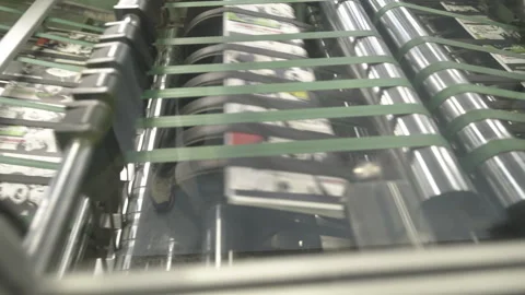 Conveyor machine with rollers and belts for cardboard moving Stock Footage 303103206