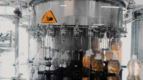 On the conveyor move plastic bottles that are filled with drinks Stock Footage 146564229