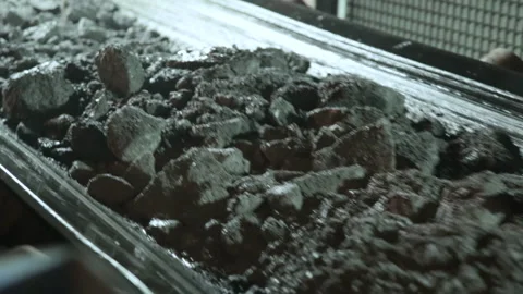 Conveyor  with ore shooting in  Close-up there is ore on belt conveyor Stock Footage 235426706