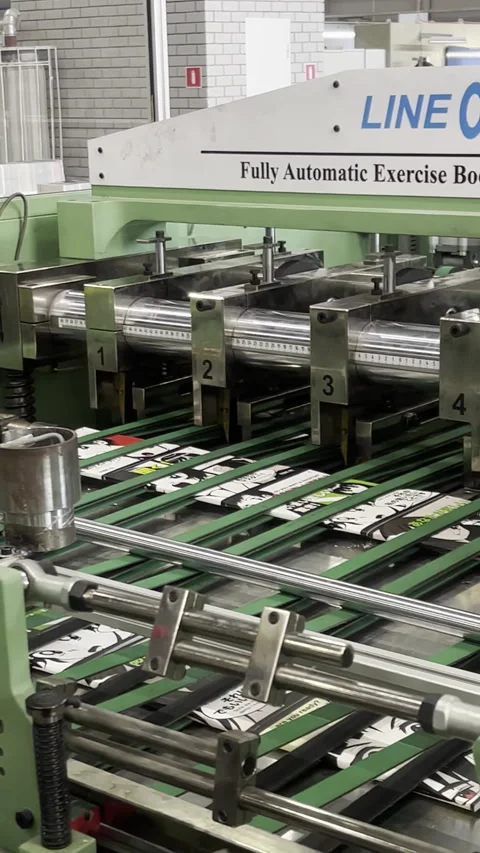 Conveyor pushes products while crew captures dynamic angles Stock Footage 313866507