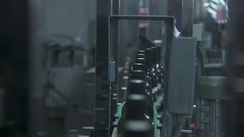 The conveyor is removed from above, bottles move along it to the camera. Stock Footage 155462410