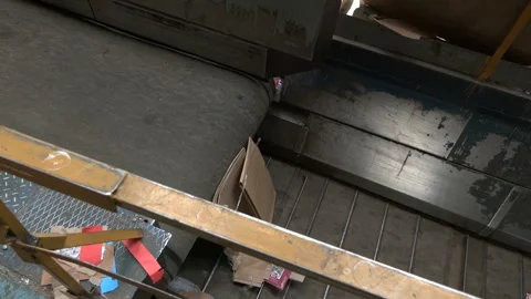 Conveyors carry trash and empty platforms at recycling plant Video stock 296086793