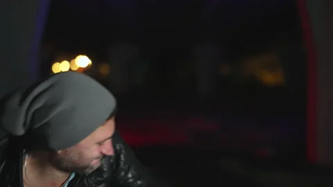 Convicted suspects beating up victim man under red blue police flasher lights. Stock Footage 161312746