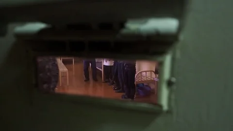 Convicts stand in the cell of correctional institution, view from behind the 스톡 동영상 81582372