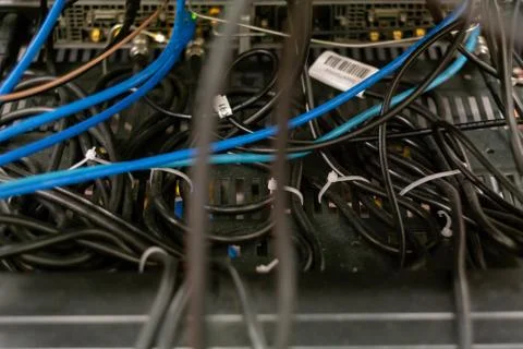 Convoluted electrical cables held together with zip ties in a science lab Fotos de archivo