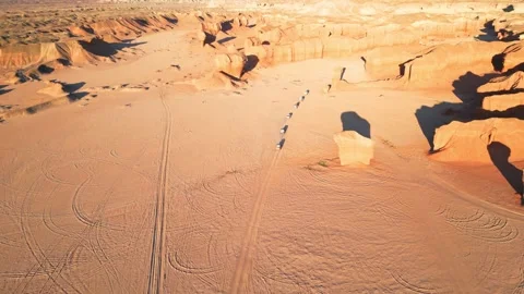 Convoy driving between sandstone cliffs Stock Footage 310664306