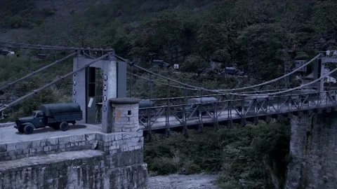 The convoy passes the cross-river bridge Stock Footage 261633360