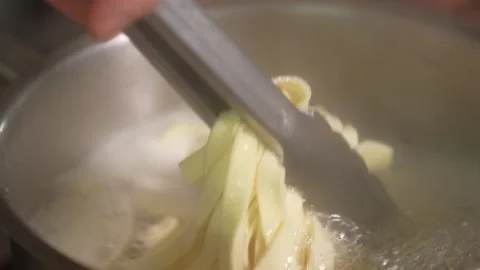 Coocking pasta on boil water Stock Footage 225487638