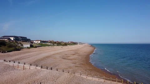 Cooden Beach, East Sussex, ascending with view towards Bexhill-on-Sea Stock Footage