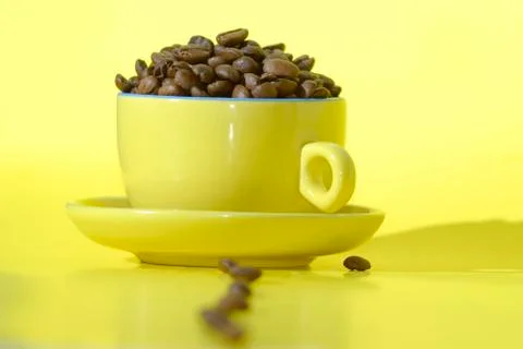 Cooffee beans and cup Stock Photos