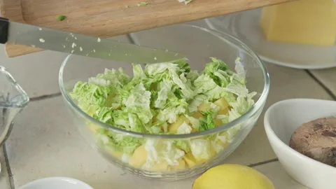 Cook adding cheese in salad. Process of preparing salad. Healthy food concept. Video stock 164651837
