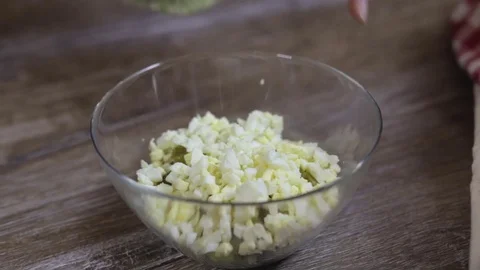 Cook adding green peas to the salad close-up Stock Footage 73079919