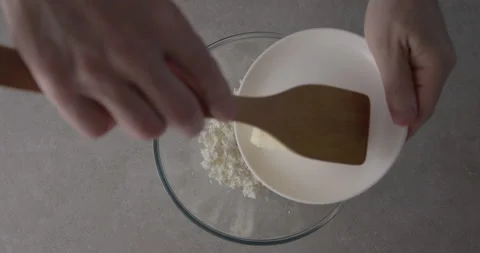 The cook adds butter to the curd close-up. Stock Footage 200889901