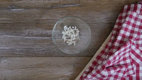 Cook adds cucumber to a salad Stock Footage 73089017