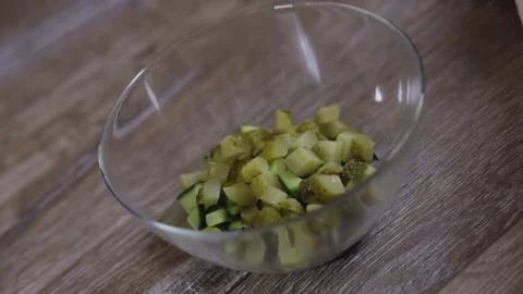 Cook adds eggs to the salad close-up Stock-Footage 73080873