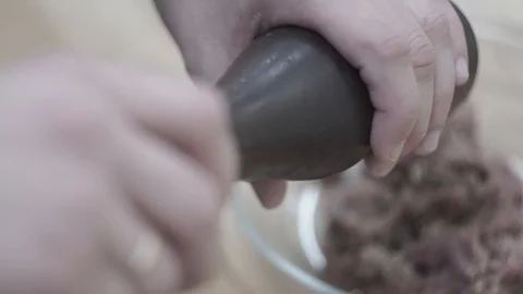 Cook adds pepper to ground beef. Close-up Stock Footage 106631330