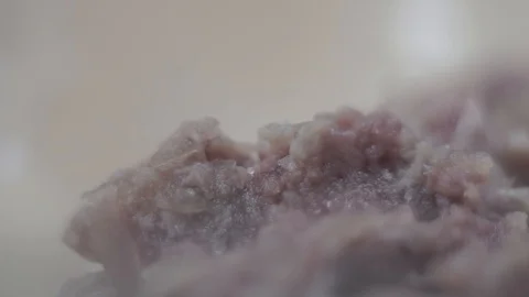 Cook adds salt to ground beef. Close-up Stock Footage 106631292