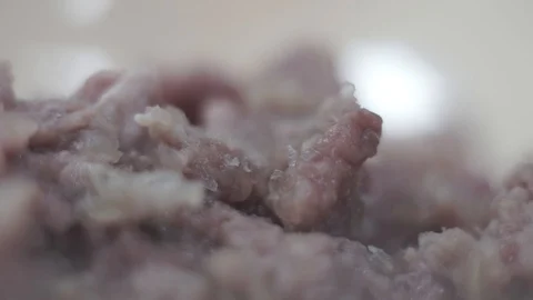 Cook adds salt to ground beef. Close-up Stock Footage 106631296