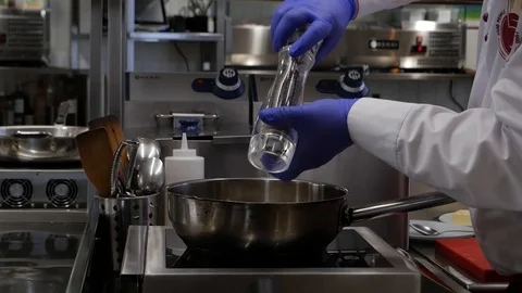 The cook adds spices Stock Footage 87311832