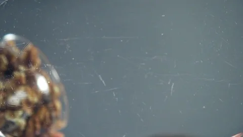 The cook adds walnuts to the dish, nuts and dried fruits, diet products, cooking Stock Footage 72979424