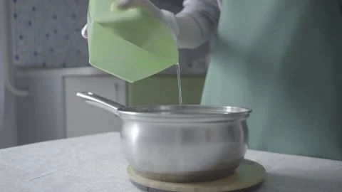 The cook adds water to the pot Stock Footage 139622155
