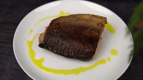 Cook adorns a piece of red fried fish. 스톡 동영상 111818651