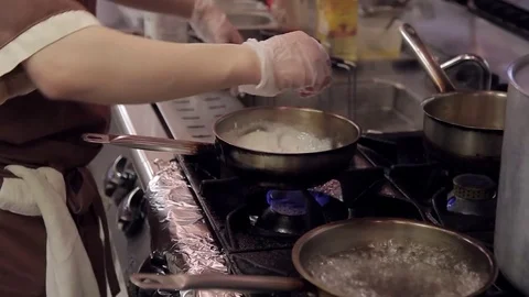 Cook after discarding pasta in a square sieve fry them in a pan Video stock 76053512