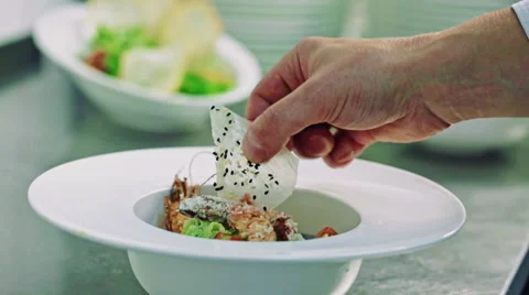 Cook and his last touch to the coulinary masterpiece Stock Footage 59338718