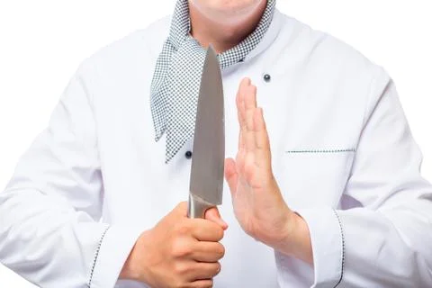 Cook and a sharp knife in his hands close up Stock Photos