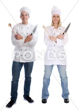 Cook apprentice trainee trainees cooks standing full body cooking with knife Stock Photos