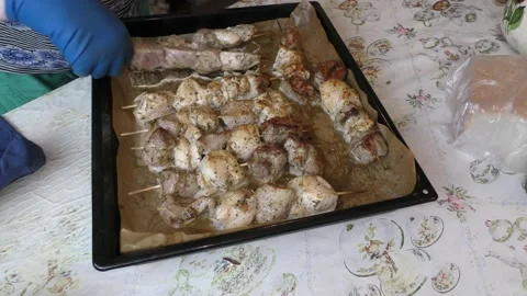 The cook bakes the meat on a baking sheet. healthy food concept Stock Footage 139703401