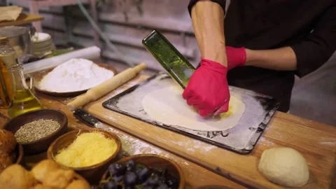 The cook bakes a pie stuffed with grapes. Stock Footage 159369739