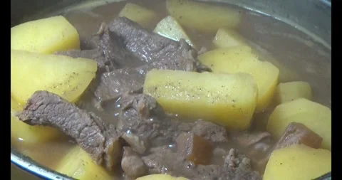Cook beef stew Stock Footage 313628246