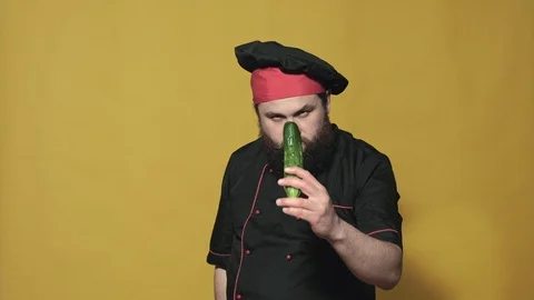 Cook in a black suit on a yellow background Stock-Footage 106340960