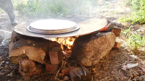 Cook bread over fire in nature 4K Stock Footage 115902513