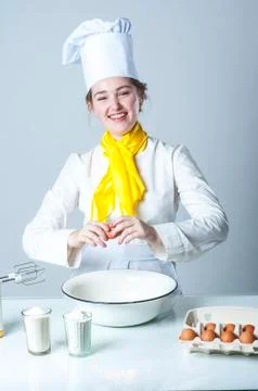 Cook breaking egg Stock Photos
