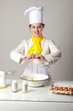 Cook breaking egg Stock Photos